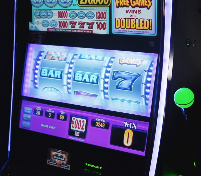 Bright casino floor filled with slot machines and table games in a major US gambling venue